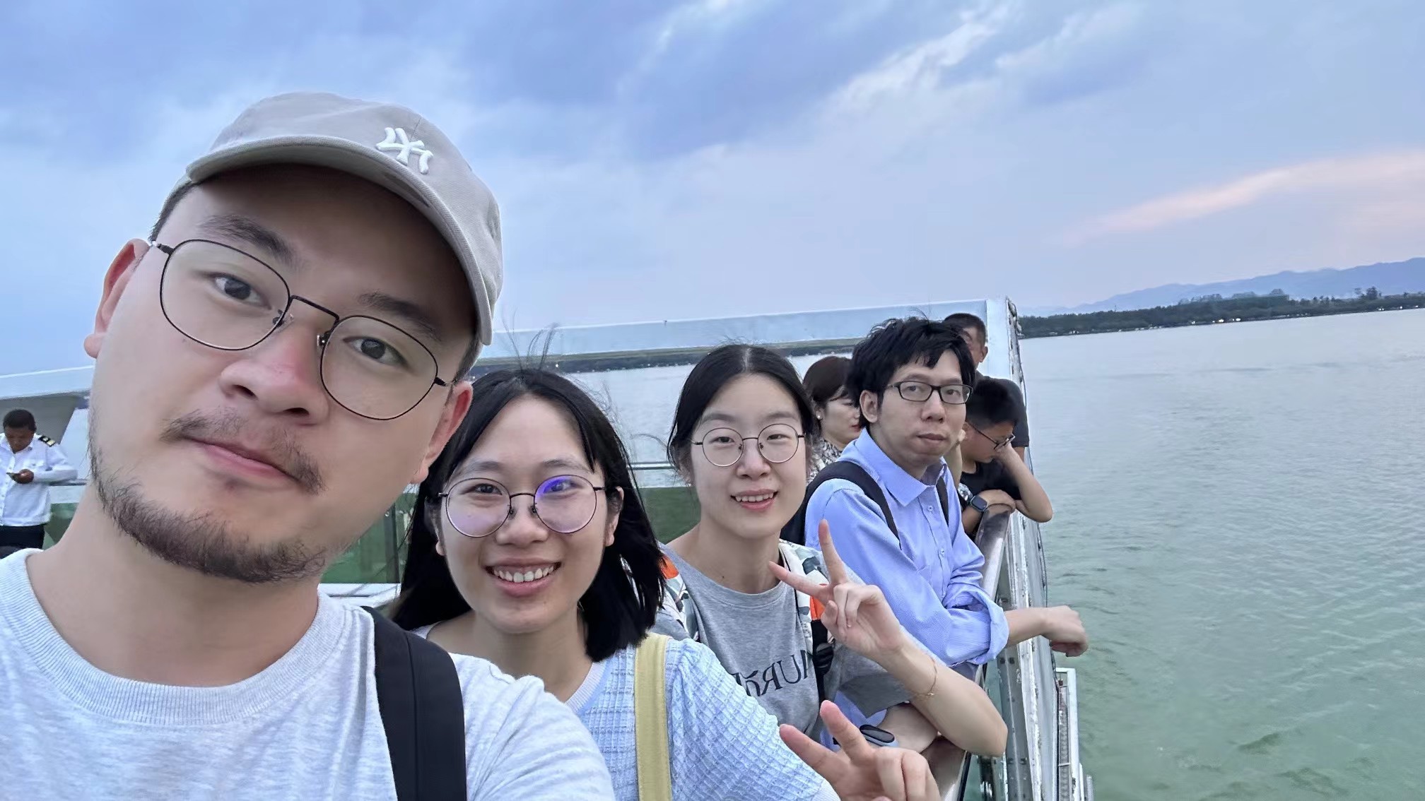 A group snapshot aboard a boat on the lake